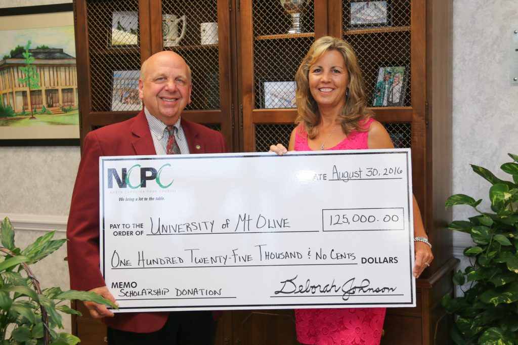 Pictured Dr. Philip P. Kerstetter, president of the University of Mount Olive, and Lorenda Overman, who serves on the executive committee and board of the North Carolina Pork Council. 