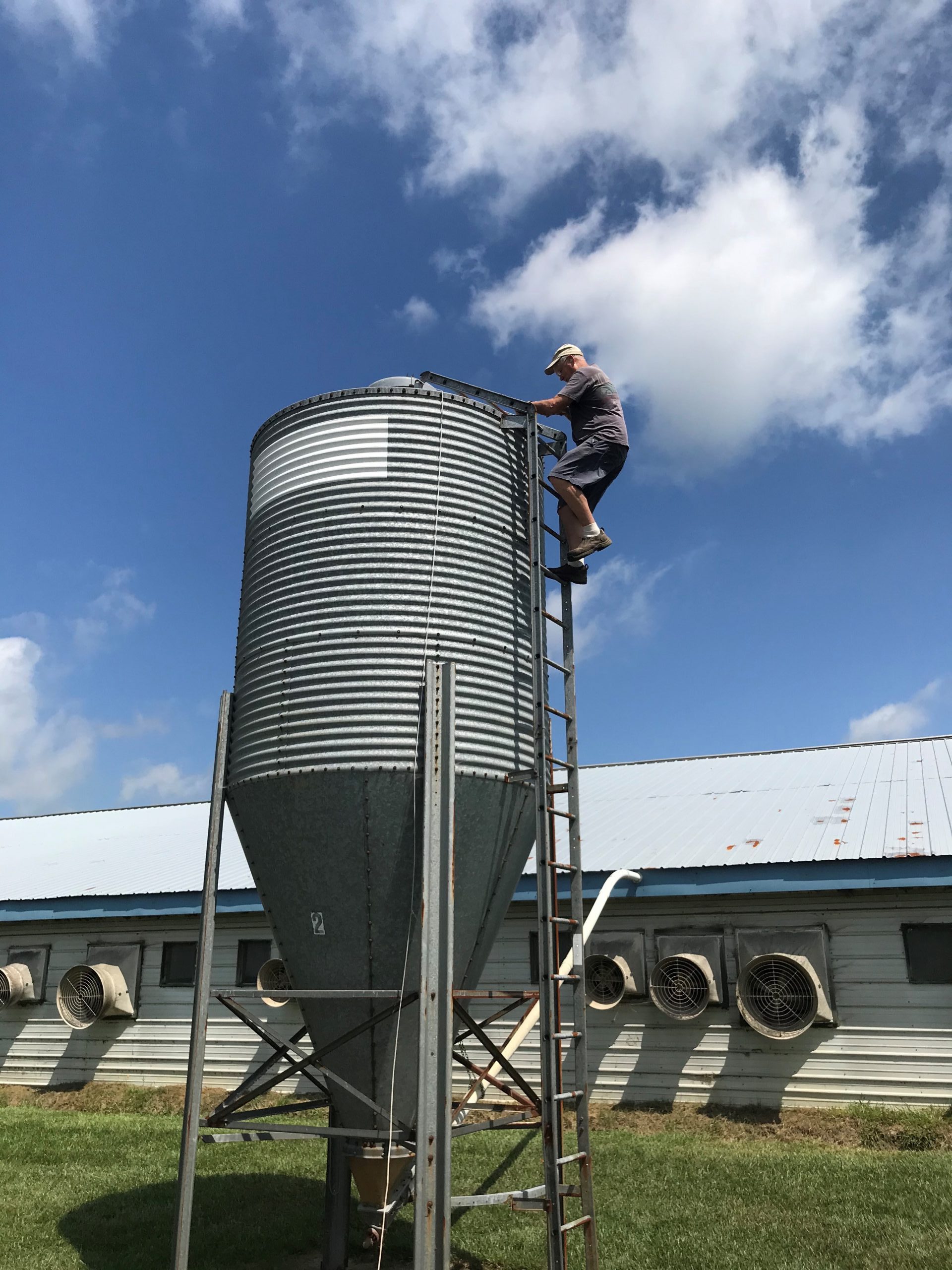 Animal health is a top priority every day, but especially when a storm hits. Here, Jack is checking to make sure the feed bins are full, and the lids are secured so they cannot be blown open, exposing the feed to rain. 